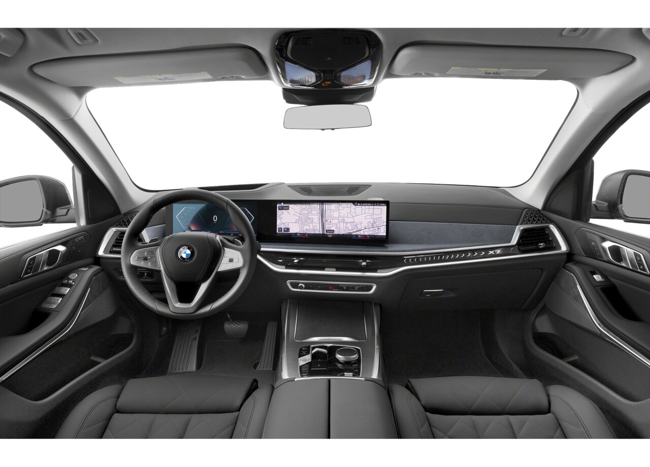 Interior of the 2025 BMW X7, featuring its premium leather seats, digital dashboard, and panoramic sunroof.