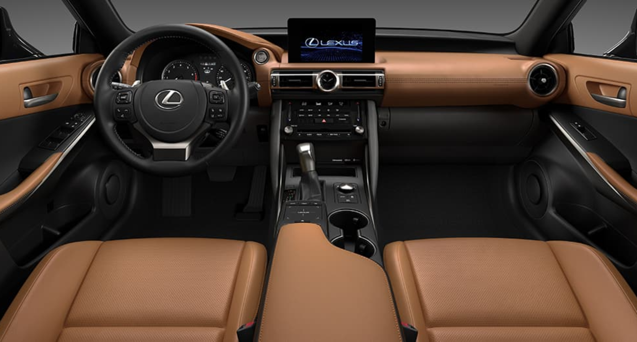 The luxurious interior of the 2025 Lexus IS 300, featuring a high-tech dashboard with a large touchscreen display, premium leather-trimmed seats in tan, and an ergonomic driver-focused cockpit.