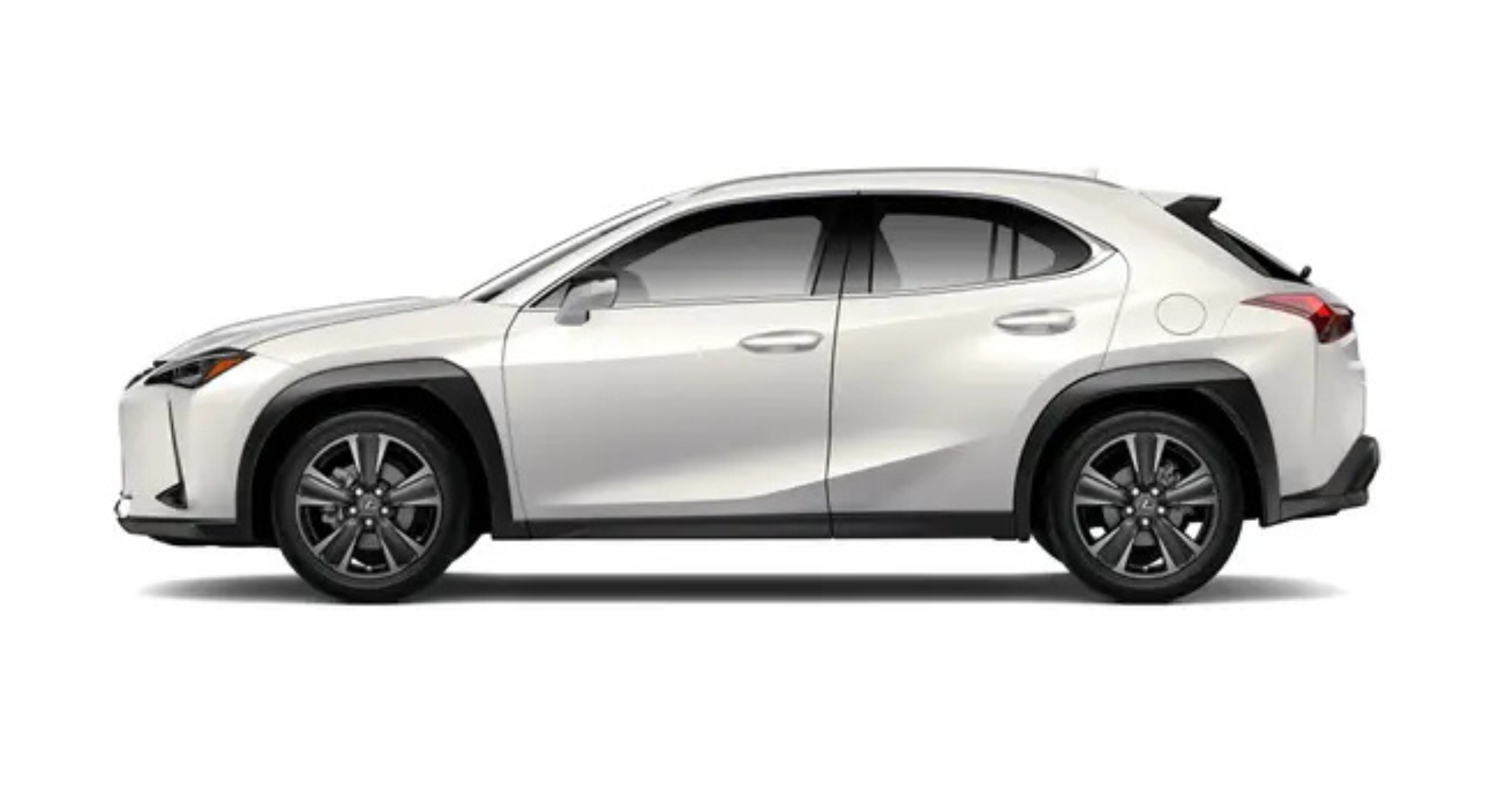 Side profile of the 2025 Lexus UX 300h in white, highlighting its compact crossover design, sharp body lines, black wheel arch cladding, and stylish alloy wheels.