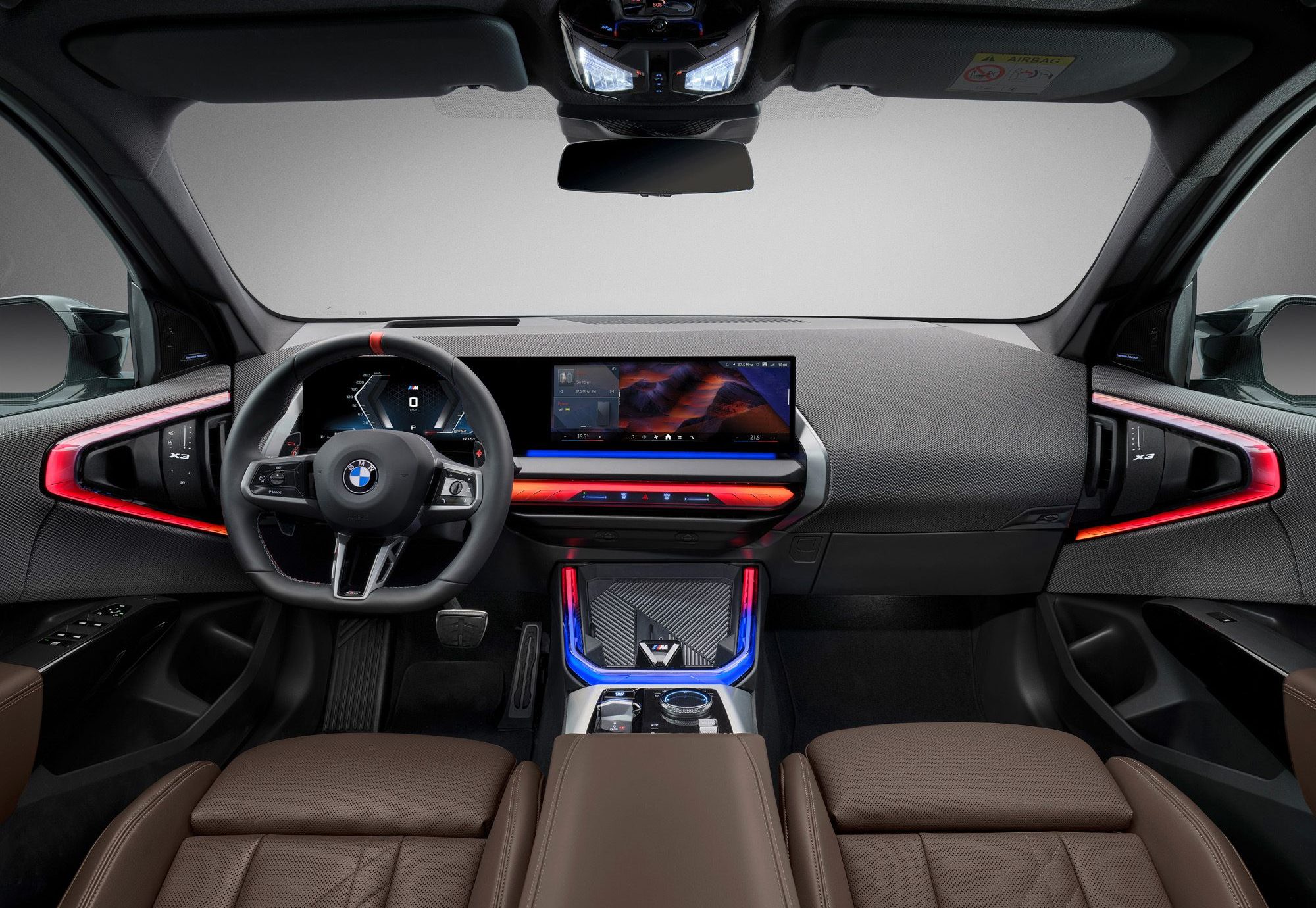 Interior of the 2025 BMW X3, featuring its premium leather seats, digital dashboard, and panoramic sunroof.