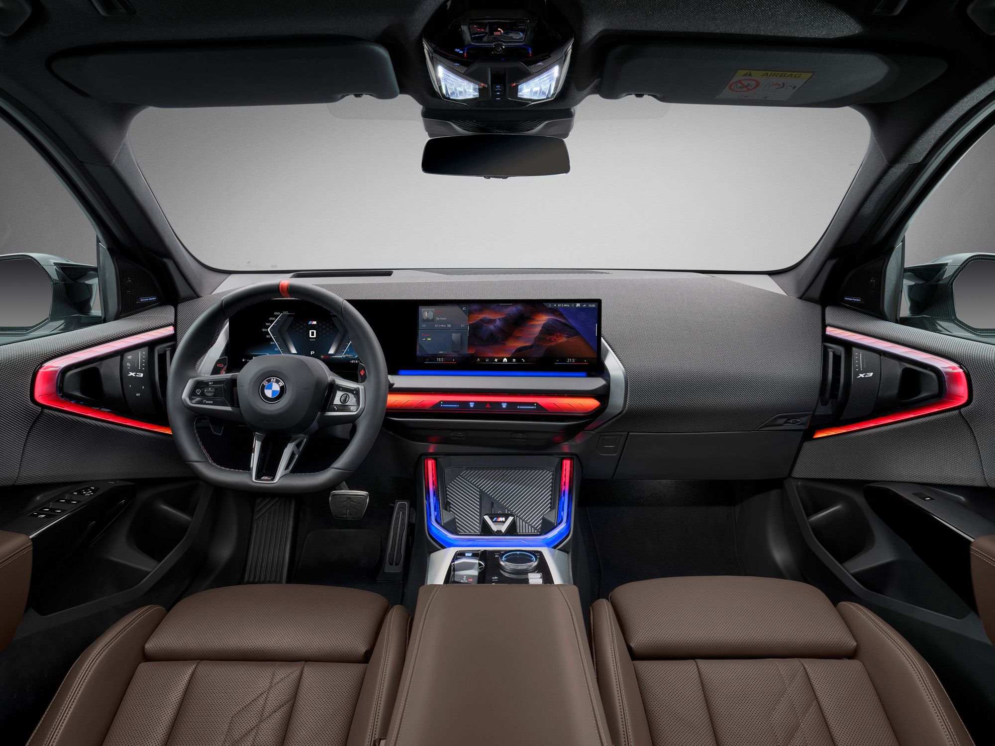 Interior of the 2025 BMW X3, featuring its premium leather seats, digital dashboard, and panoramic sunroof.