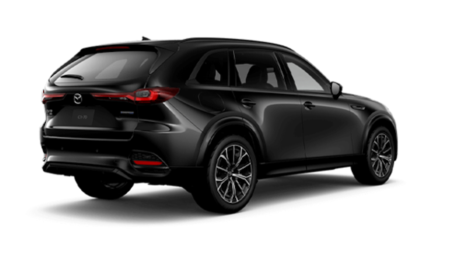 Rear view of the 2025 Mazda CX-70 PHEV, showcasing its LED taillights, dual exhaust system, and spacious cargo area