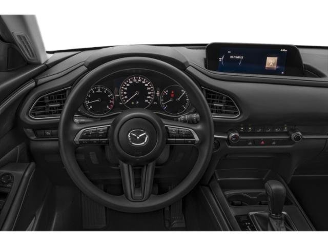 Interior of the 2025 Mazda CX-30, featuring its premium leather seats, digital dashboard, and infotainment touchscreen.