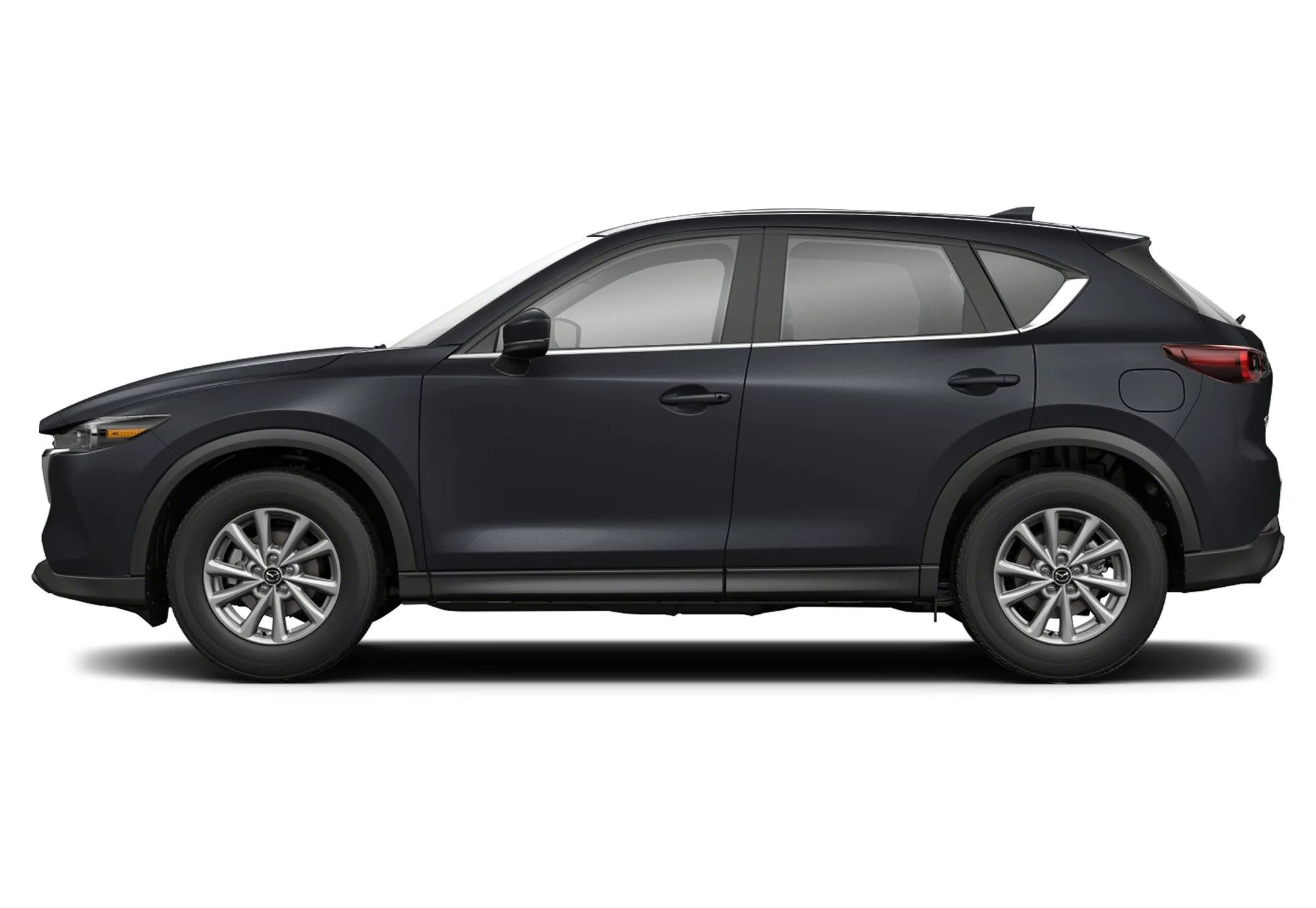 Side view of the Mazda CX-5, highlighting its sleek body lines, alloy wheels, and sporty crossover look.