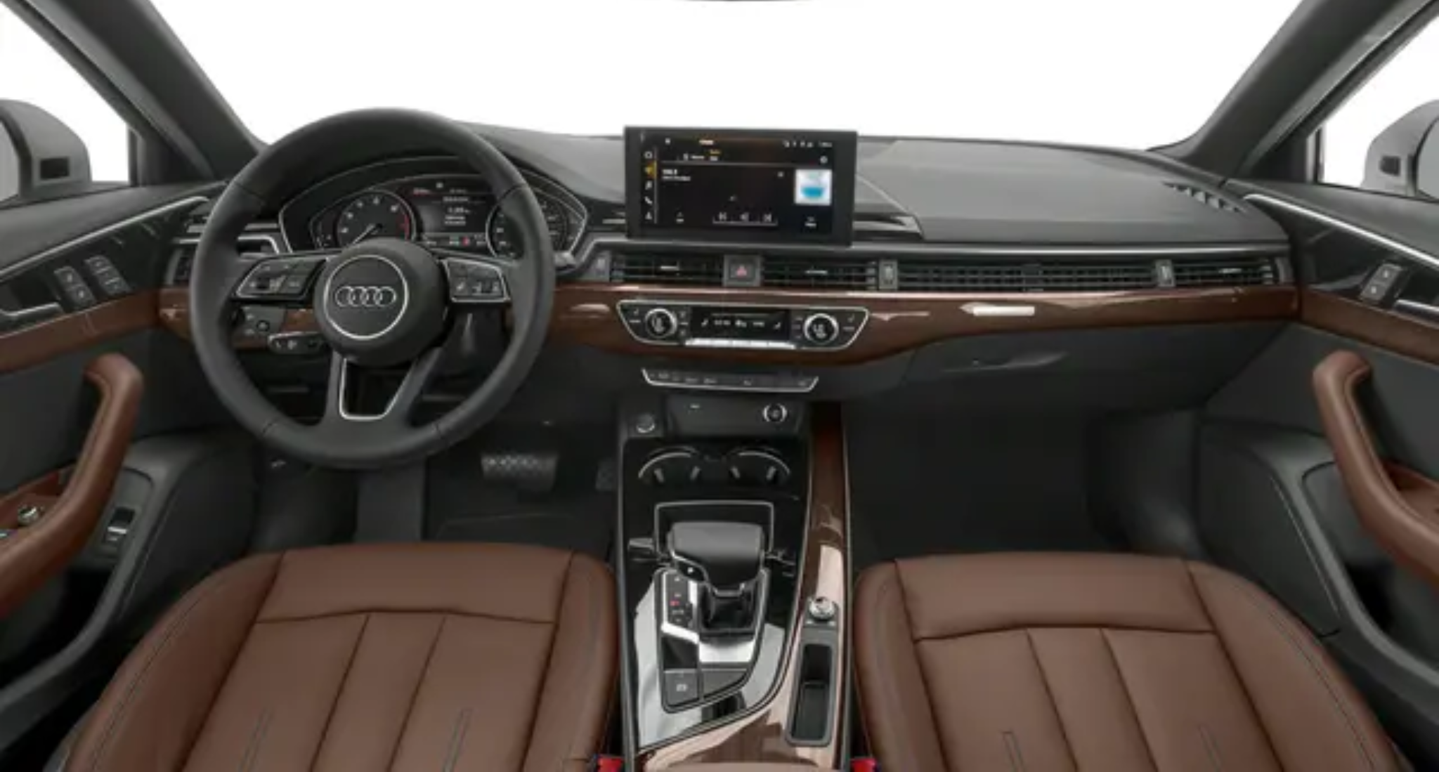 2025 Audi A4 Premium 40 TFSI quattro AWD interior dashboard featuring a luxurious brown leather-trimmed cabin, digital Virtual Cockpit, 10.1-inch MMI touchscreen infotainment system, and ergonomic steering wheel with Audi controls.