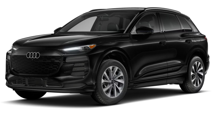 Front exterior view of the 2025 Audi Q6 e-tron with a bold grille, signature LED headlights, and a modern electric SUV design.