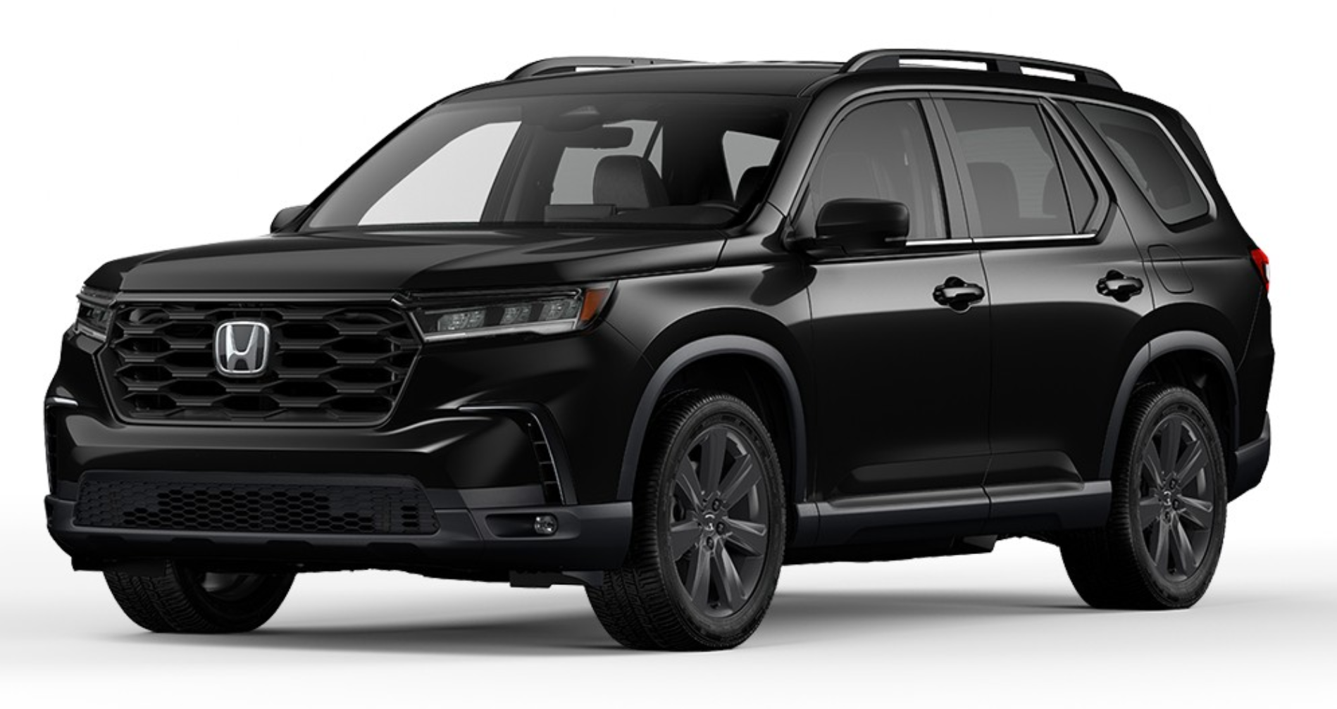 Front angled view of the 2025 Honda Pilot Sports AWD emphasizing its bold grille design, LED headlights, and robust presence.