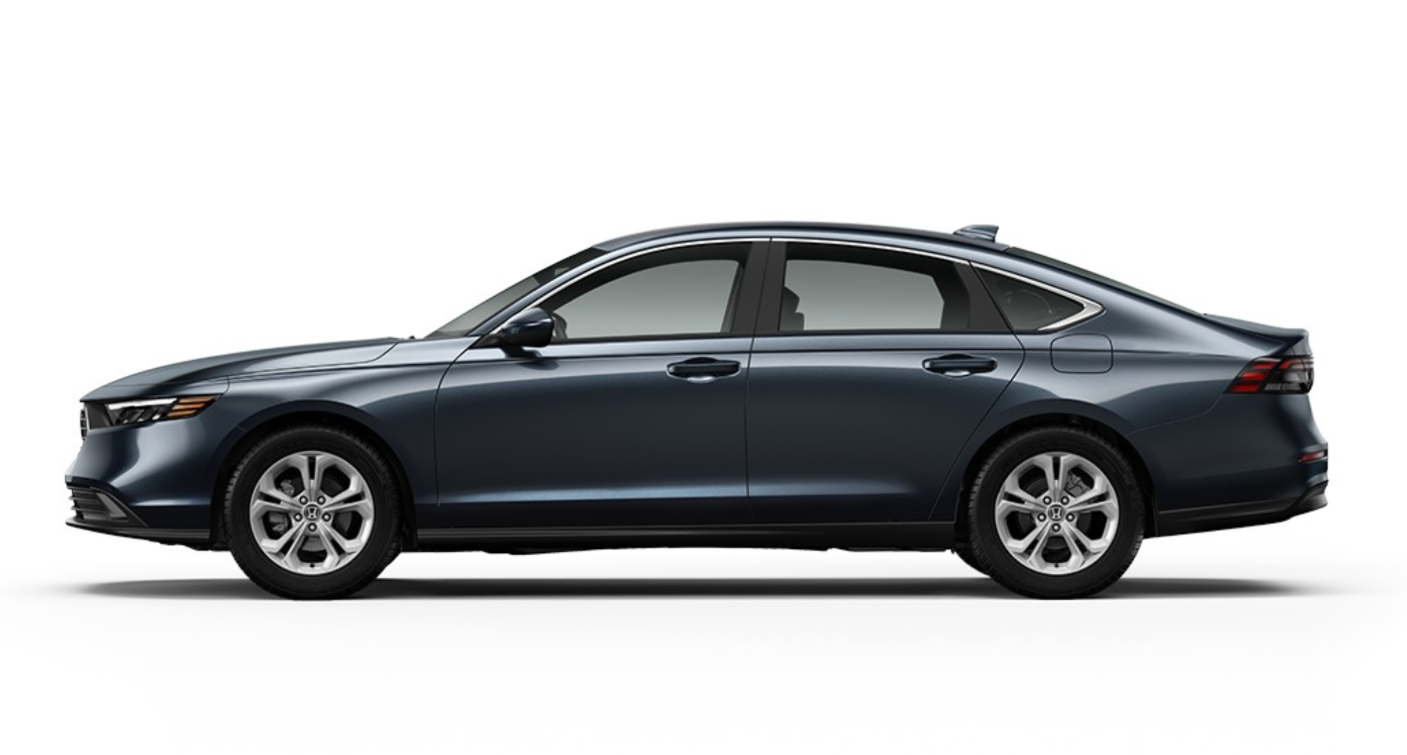 Side profile of the 2025 Honda Accord LX sedan, emphasizing its streamlined body, alloy wheels, and stylish, aerodynamic form.