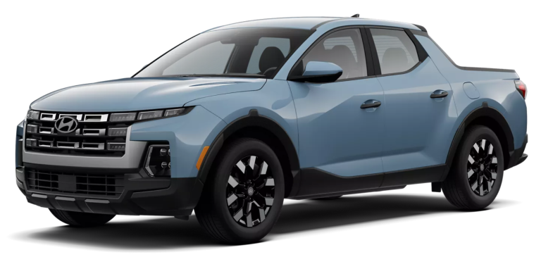 Front exterior of the 2025 Hyundai Santa Cruz SE featuring a wide grille with integrated LED headlights, aerodynamic hood design, and rugged front bumper.