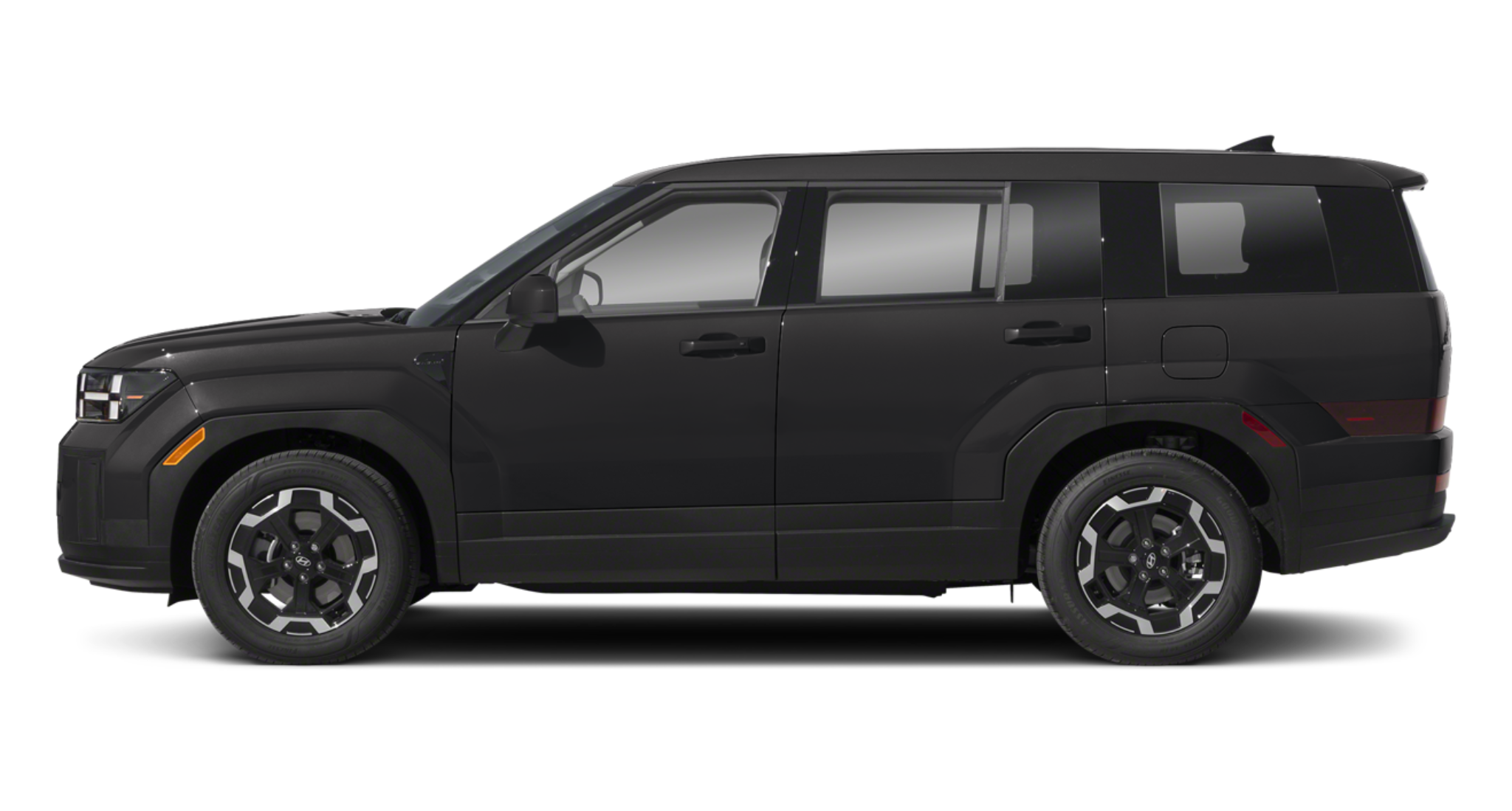 Side profile of the 2025 Hyundai Santa Fe SE in black, highlighting its bold, boxy SUV design, alloy wheels, and spacious rear windows.