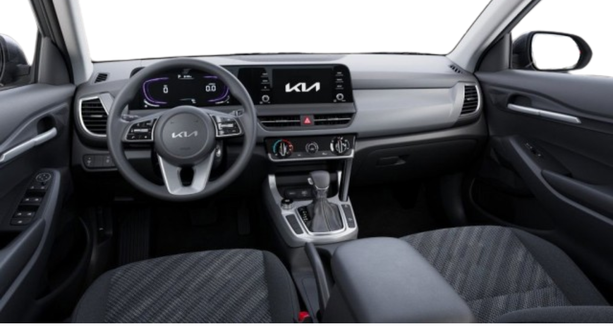 Interior view of the 2025 Kia Seltos LX AWD featuring the driver-centric dashboard, multifunction steering wheel, 8-inch touchscreen display, and premium cloth seats.