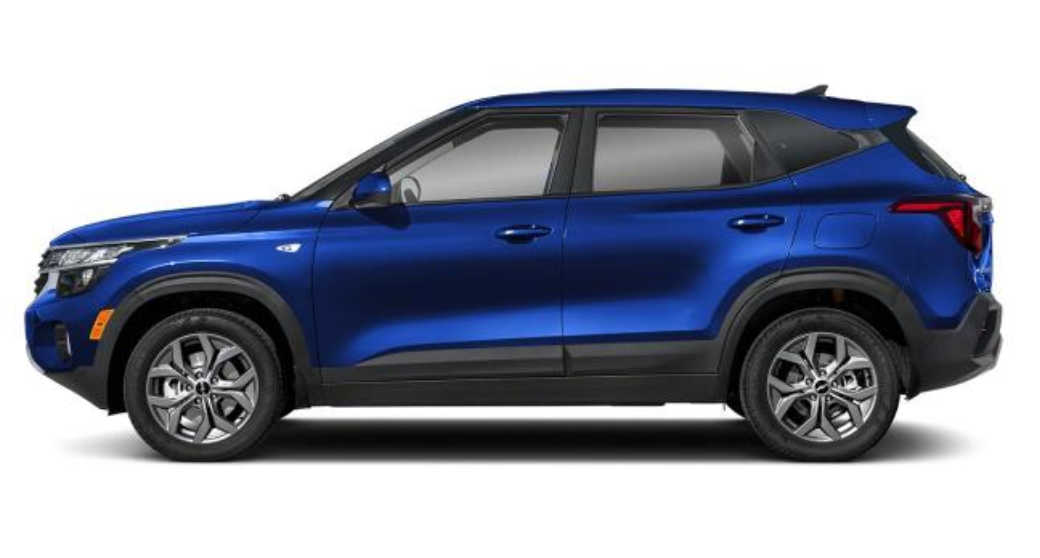 Side profile view of the 2025 Kia Seltos LX AWD compact SUV in blue, featuring sleek body lines, 17-inch alloy wheels, and aerodynamic design.