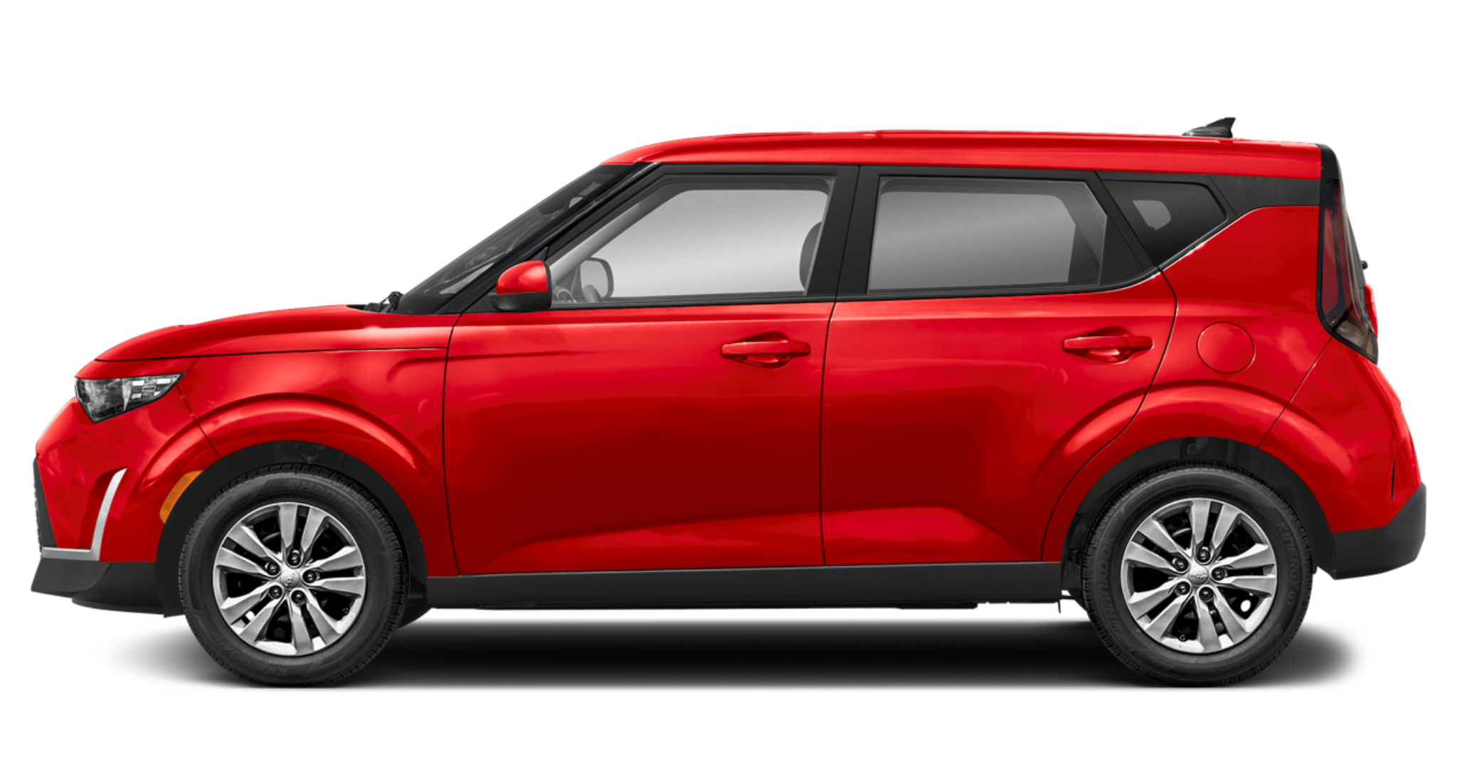 Side profile of the 2025 Kia Soul LX FWD in red, showcasing its distinctive compact SUV shape, 16-inch alloy wheels, and aerodynamic design.