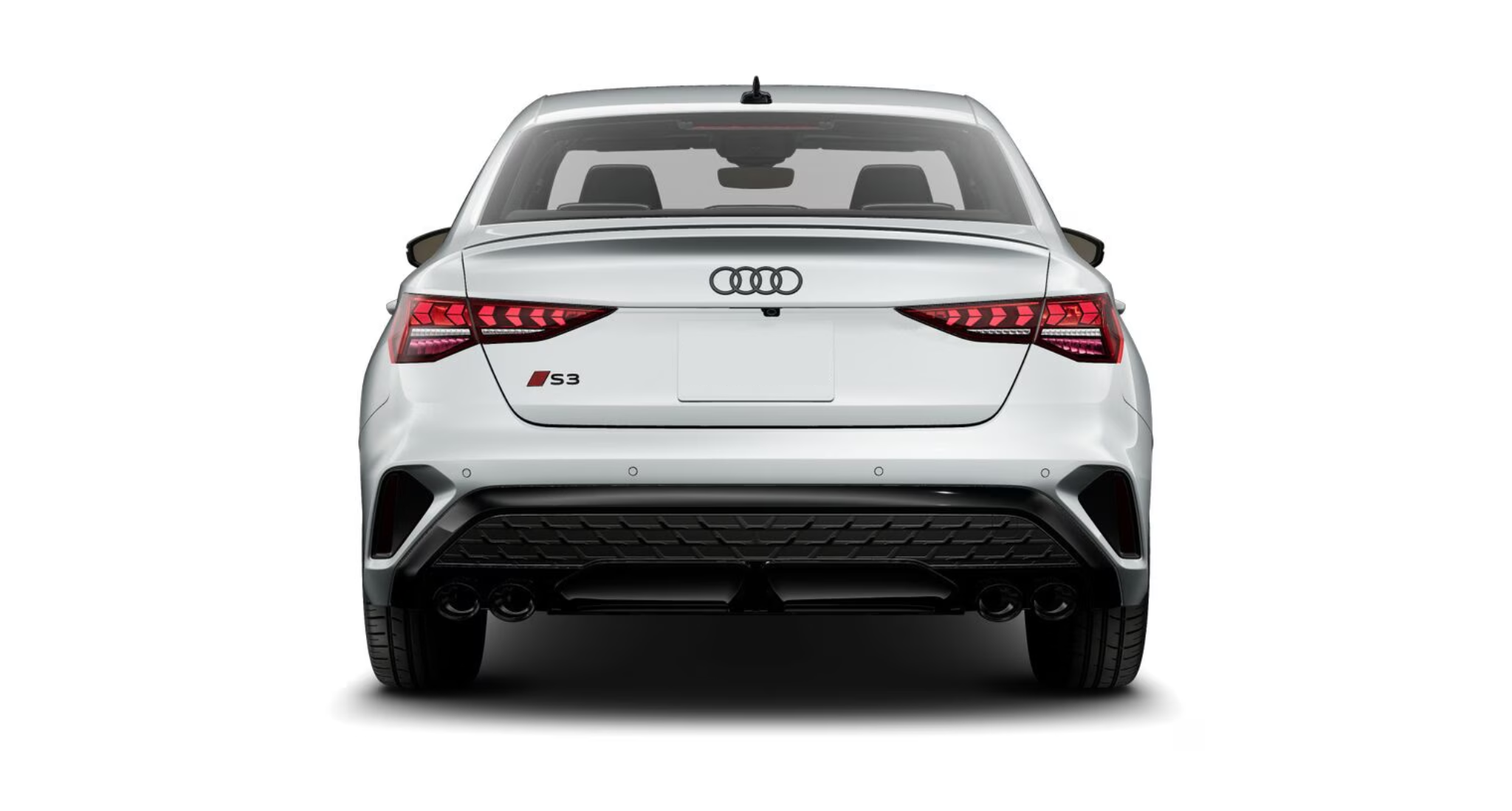 The 2025 Audi S3 rear design with stylish LED taillights, quad exhaust outlets, and a sporty diffuser, emphasizing its high-performance capabilities.