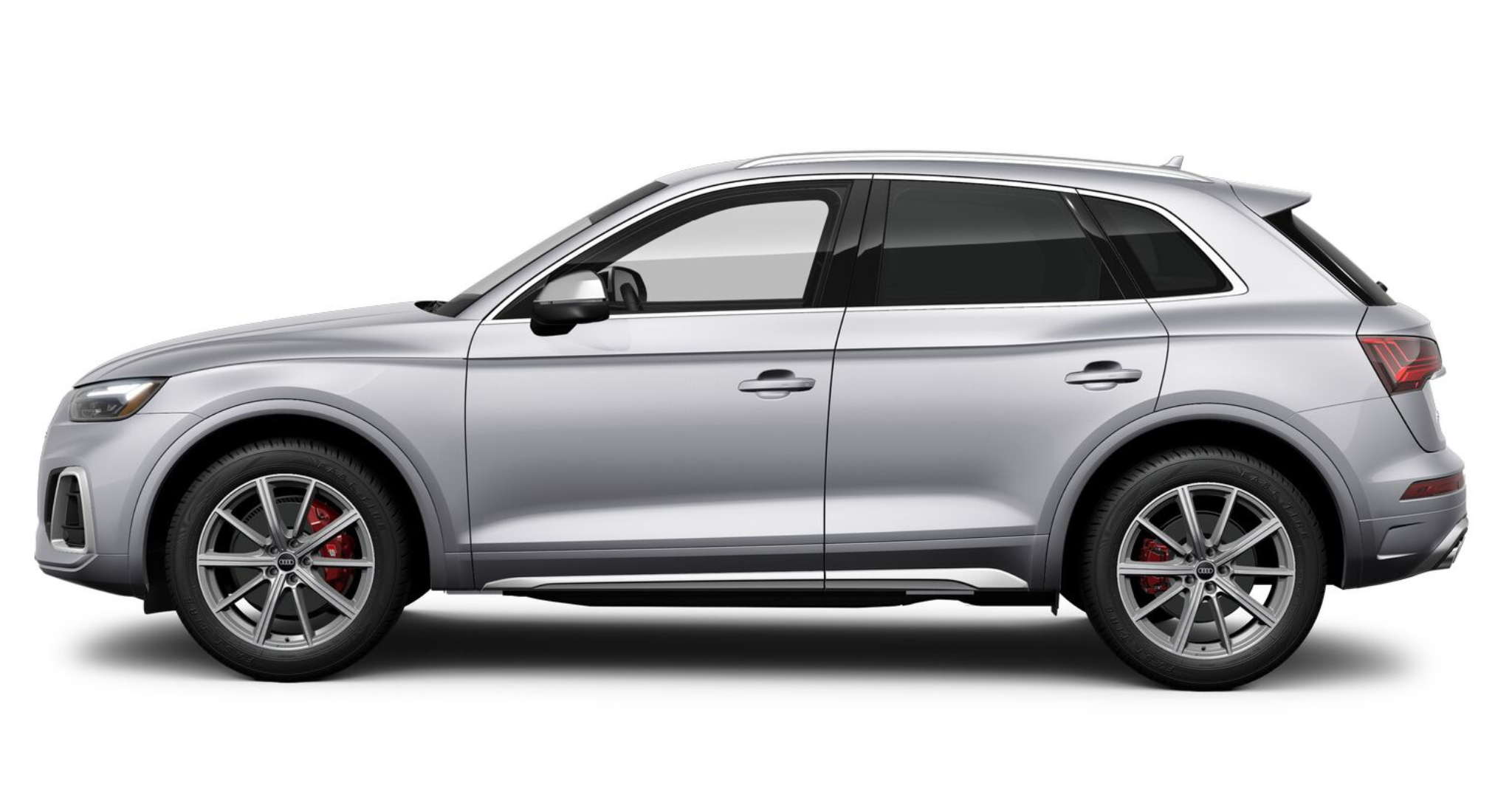 Side profile of the 2025 Audi SQ5 SUV in metallic silver, displaying 20-inch alloy wheels, red brake calipers, and aerodynamic body lines for a sporty, elegant look.