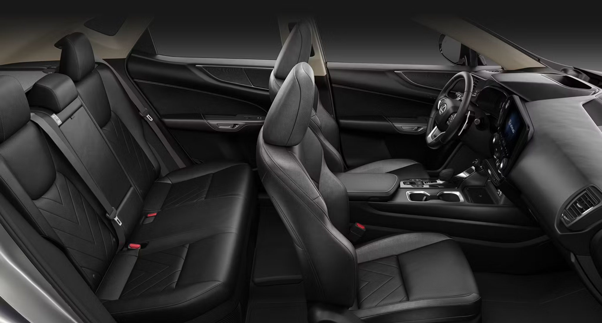 2025 Lexus NX 450h rear seat interior view featuring premium perforated leather upholstery, chevron-quilted seat design, and spacious passenger comfort.