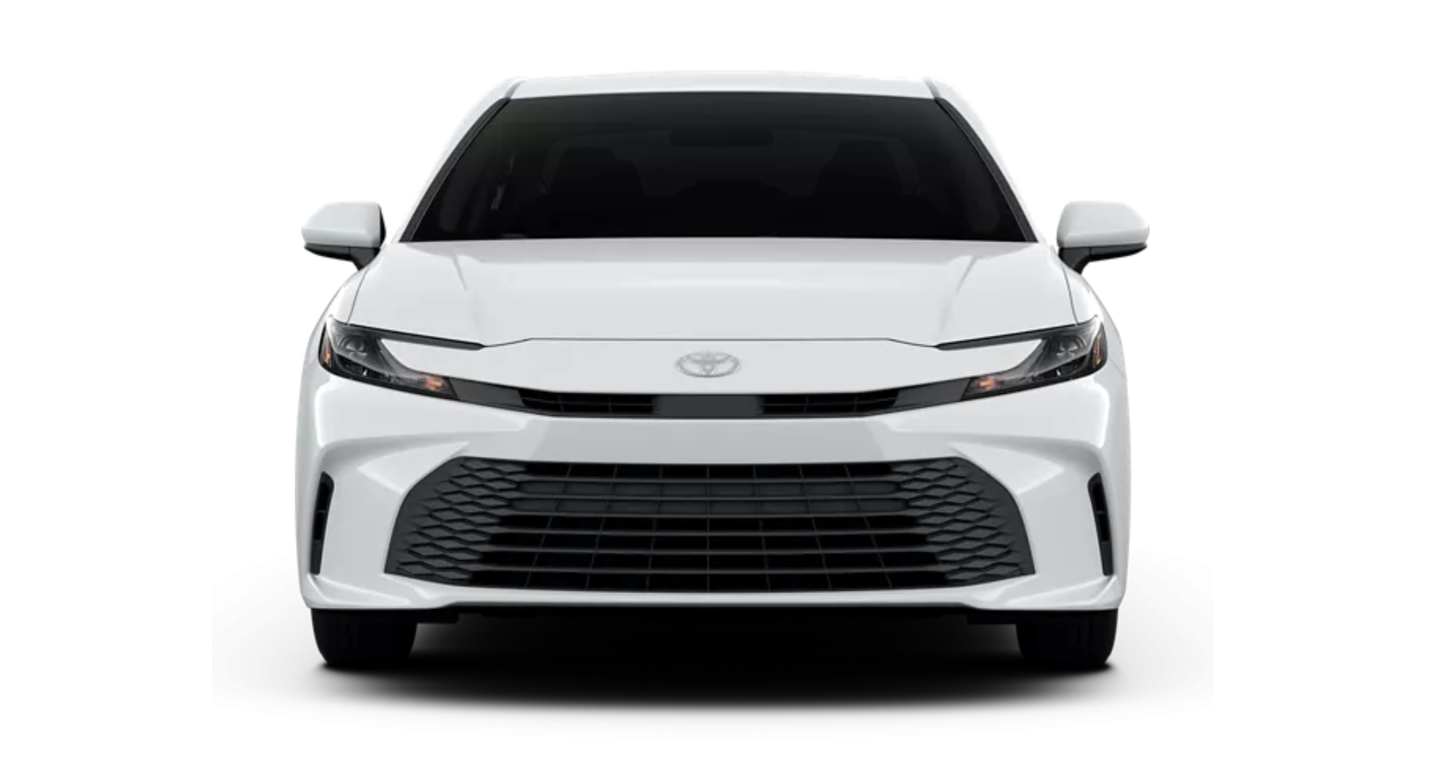 Front view of the 2025 Toyota Camry LE in white, showcasing the bold black grille, sleek LED headlights, and modern styling.