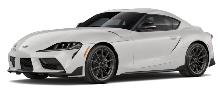 Angled front view of the 2025 Toyota GR Supra 3.0 RWD in white, highlighting its 19-inch alloy wheels, aerodynamic curves, and bold sports coupe styling.