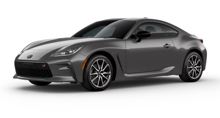 2025 Toyota GR86 front three-quarter angle showing its aerodynamic design, sculpted body lines, 17-inch alloy wheels, and distinctive front grille with GR branding.