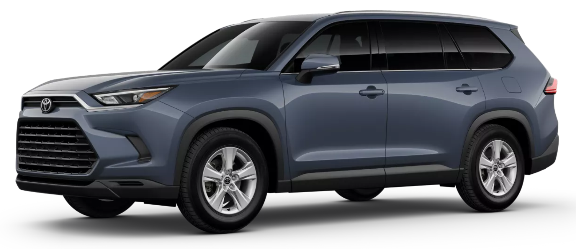 Side angle view of the 2025 Toyota Grand Highlander Hybrid LE AWD in blueprint color with alloy wheels and sleek hybrid SUV design.