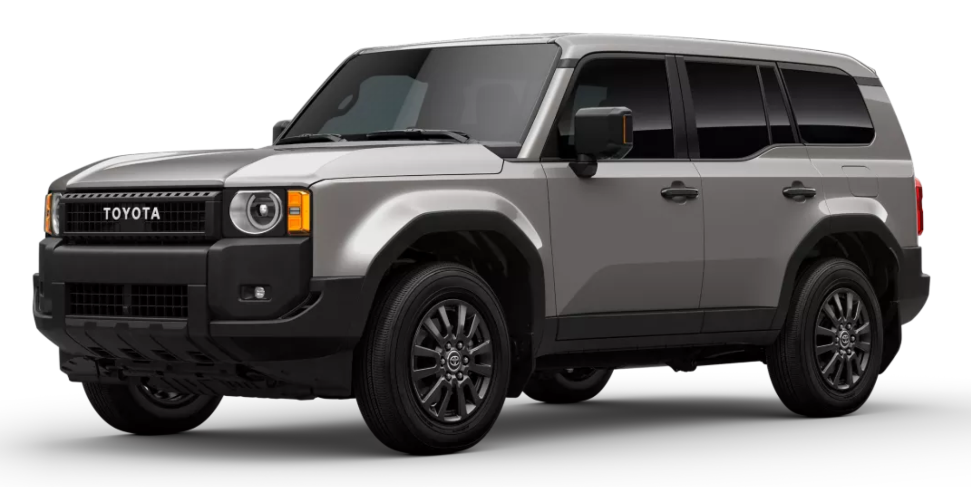 2025 Toyota Land Cruiser 1958 AWD in gray, showing off-road-ready stance, squared body design, and dark gray alloy wheels.
