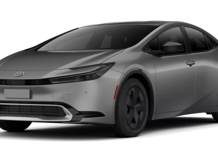 Front view of the 2025 Toyota Prius PHEV LE in silver, displaying its modern front grille, slim LED headlights, and aerodynamic bumper design.