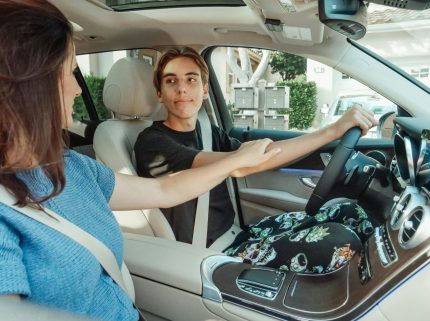 Teenager signing a car lease for teenagers with Best Deal Auto Leasing expert auto broker in 2025