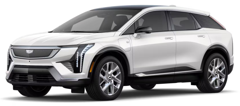 2025 Cadillac Optiq Luxury AWD EV front exterior view highlighting illuminated grille, sleek headlights, and aerodynamic design.