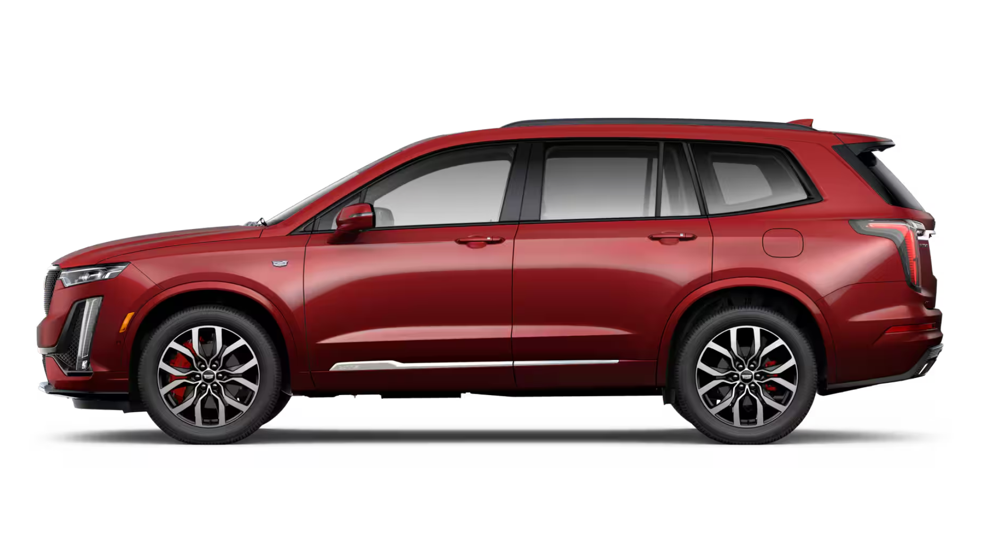 Side profile view of the 2025 Cadillac XT6 Luxury AWD showcasing bold exterior styling, sleek body lines, and 18-inch multi-spoke alloy wheels.