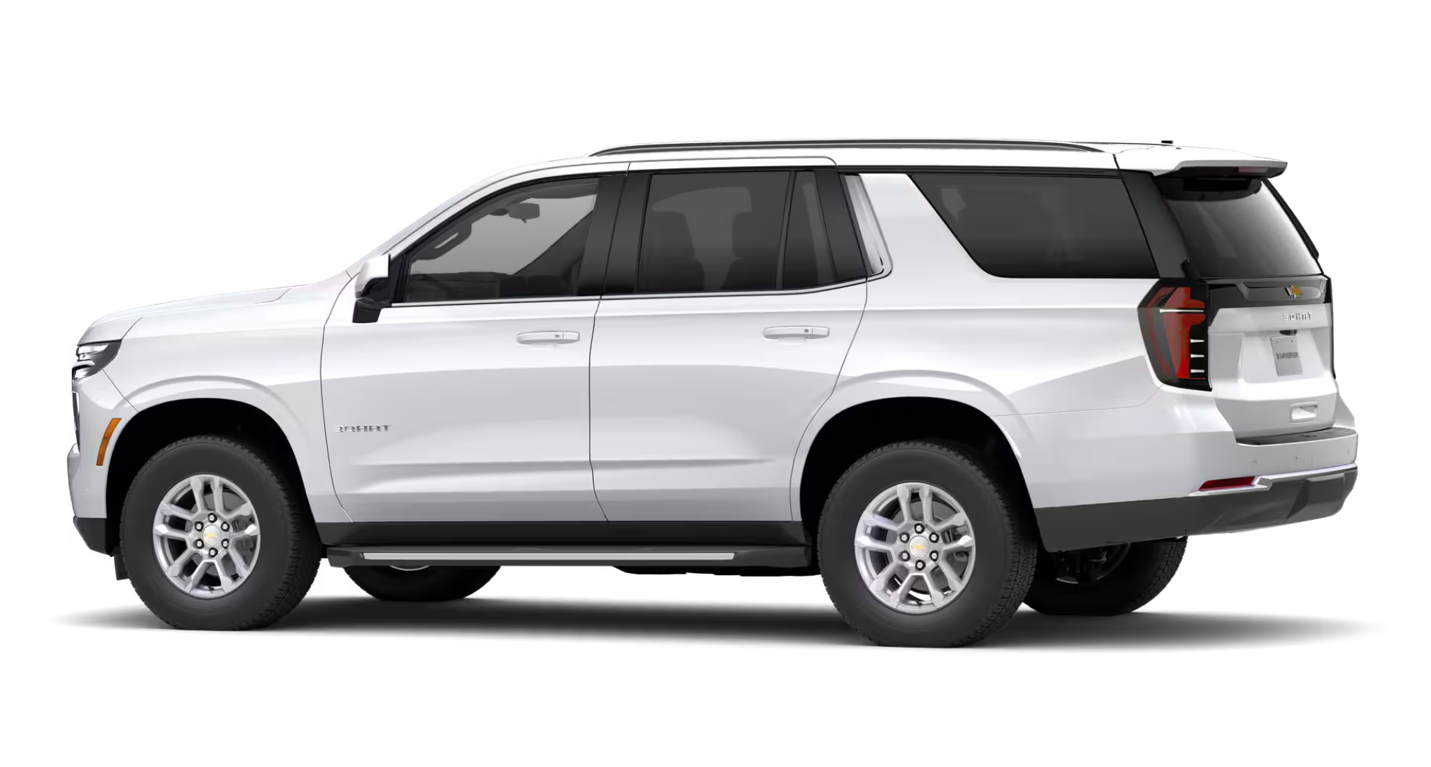 2025 Chevrolet Tahoe 4WD full side view in white, displaying rugged SUV proportions, alloy wheels, and black lower trim accents.