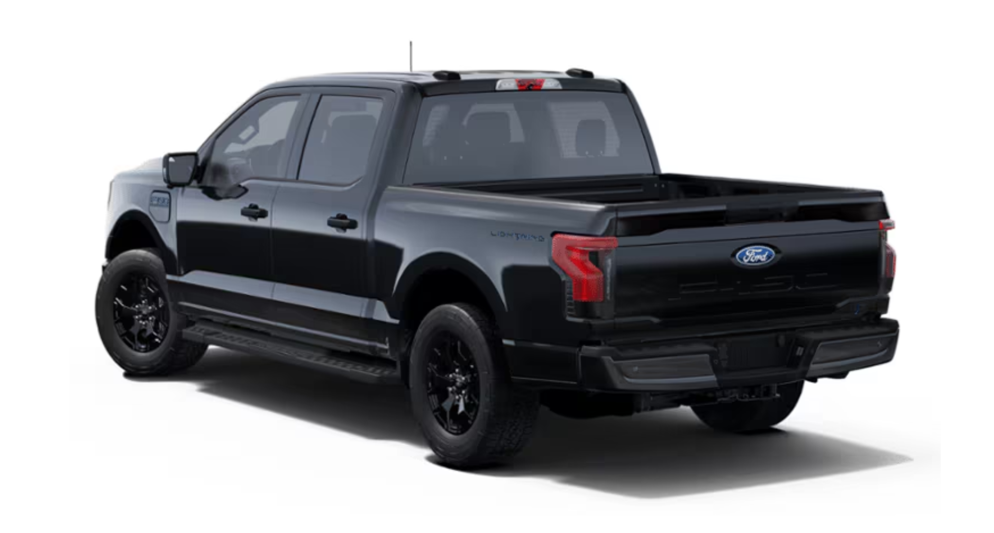 2025 Ford F-150 Lightning XLT EV rear view highlighting LED tail lights, Lightning badge, and spacious truck bed.