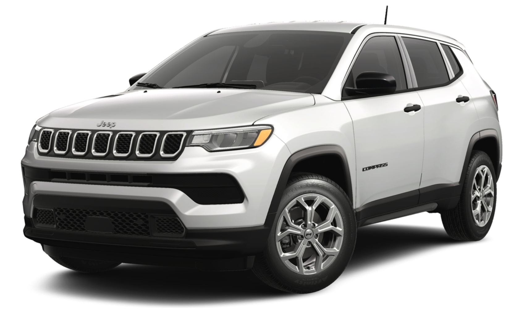 Front view of the 2025 Jeep Compass Sport AWD in white with signature seven-slot grille, LED headlights, and aerodynamic styling.