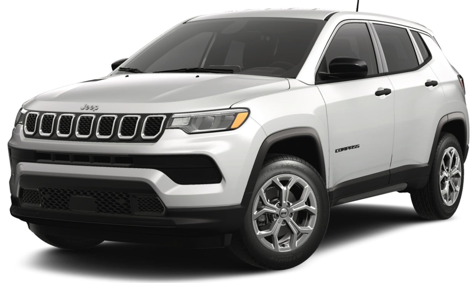 Front view of the 2025 Jeep Compass Sport AWD in white with signature seven-slot grille, LED headlights, and aerodynamic styling.