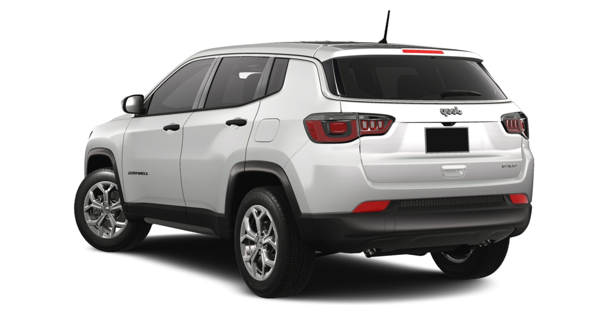 Rear view of the 2025 Jeep Compass Sport AWD showcasing LED taillights, all-wheel drive badging, and roof-mounted spoiler.
