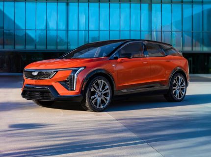 2025 Cadillac Optiq Review: Front view of luxury EV SUV in Celestial Metallic.
