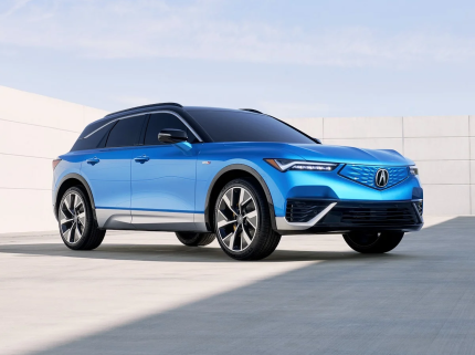Front view of the 2024 Acura ZDX Review, showcasing the illuminated Seamless Pentagon Grille on this luxury EV SUV.