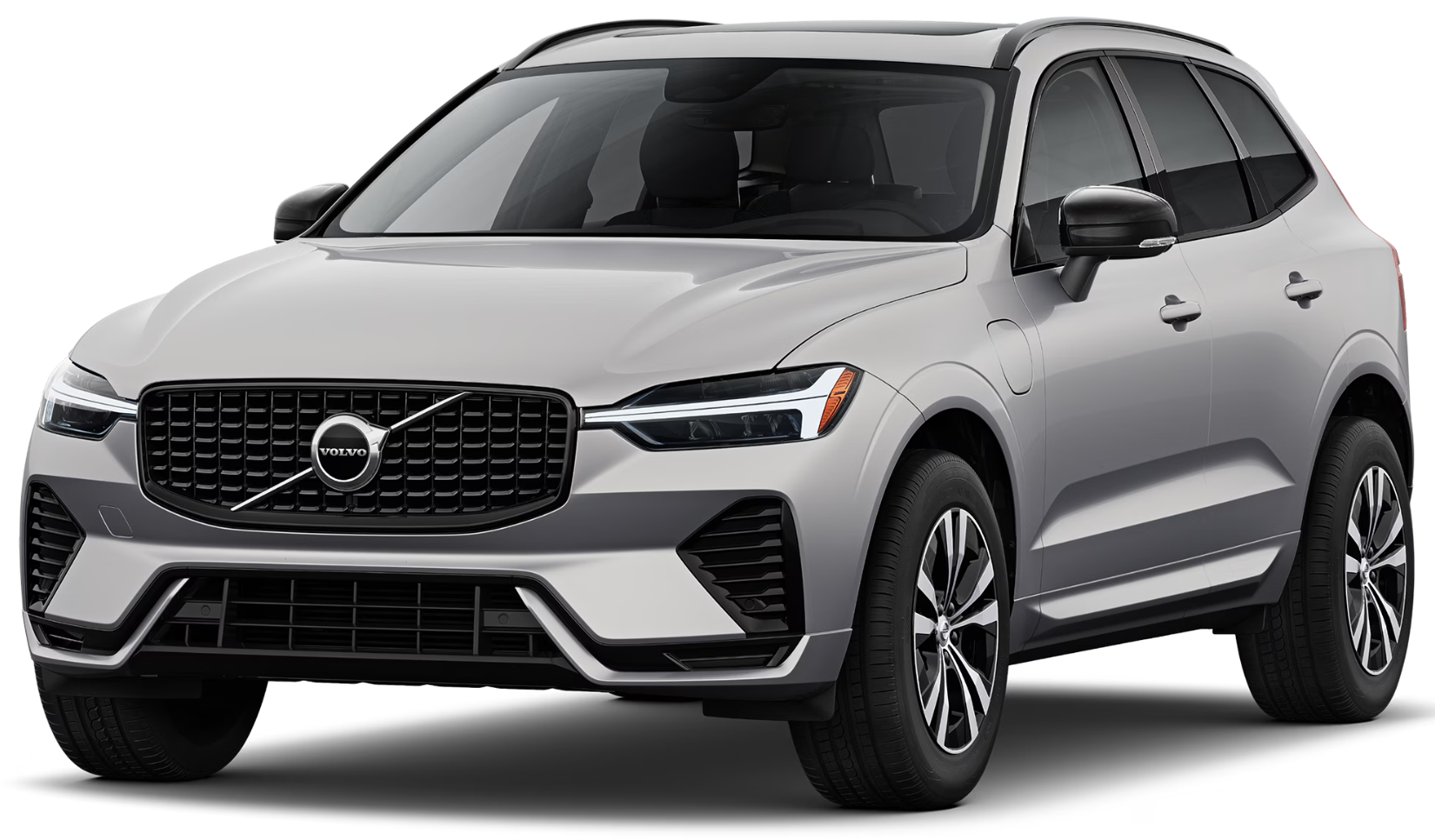 Front exterior of the 2025 Volvo XC60 PHEV AWD highlighting the bold grille, LED headlights, and plug-in hybrid charging port.