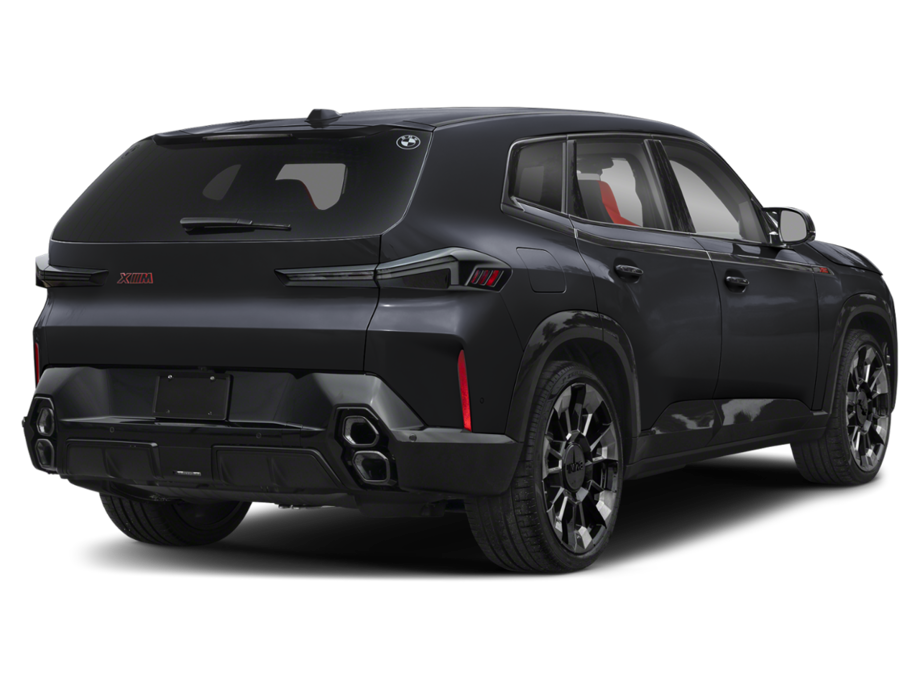 Rear profile of the 2025 BMW XM PHEV AWD showcasing quad exhaust, rear diffuser, and M badge under Shadowline trim.